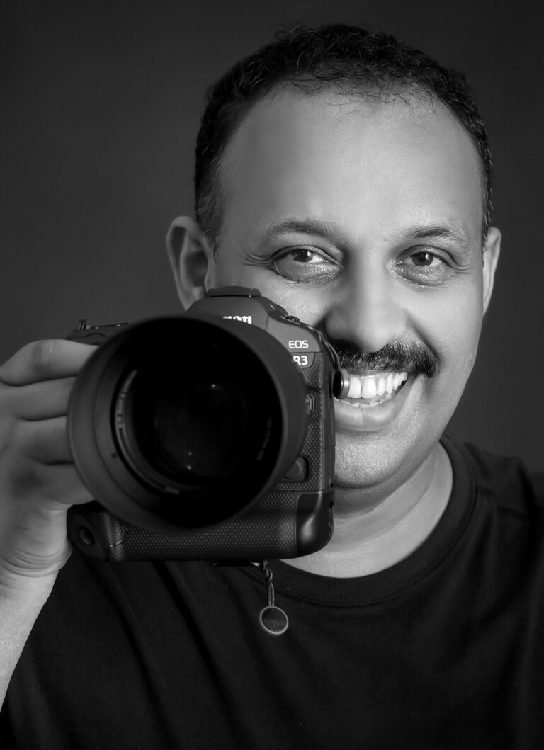 sl anand holding camera